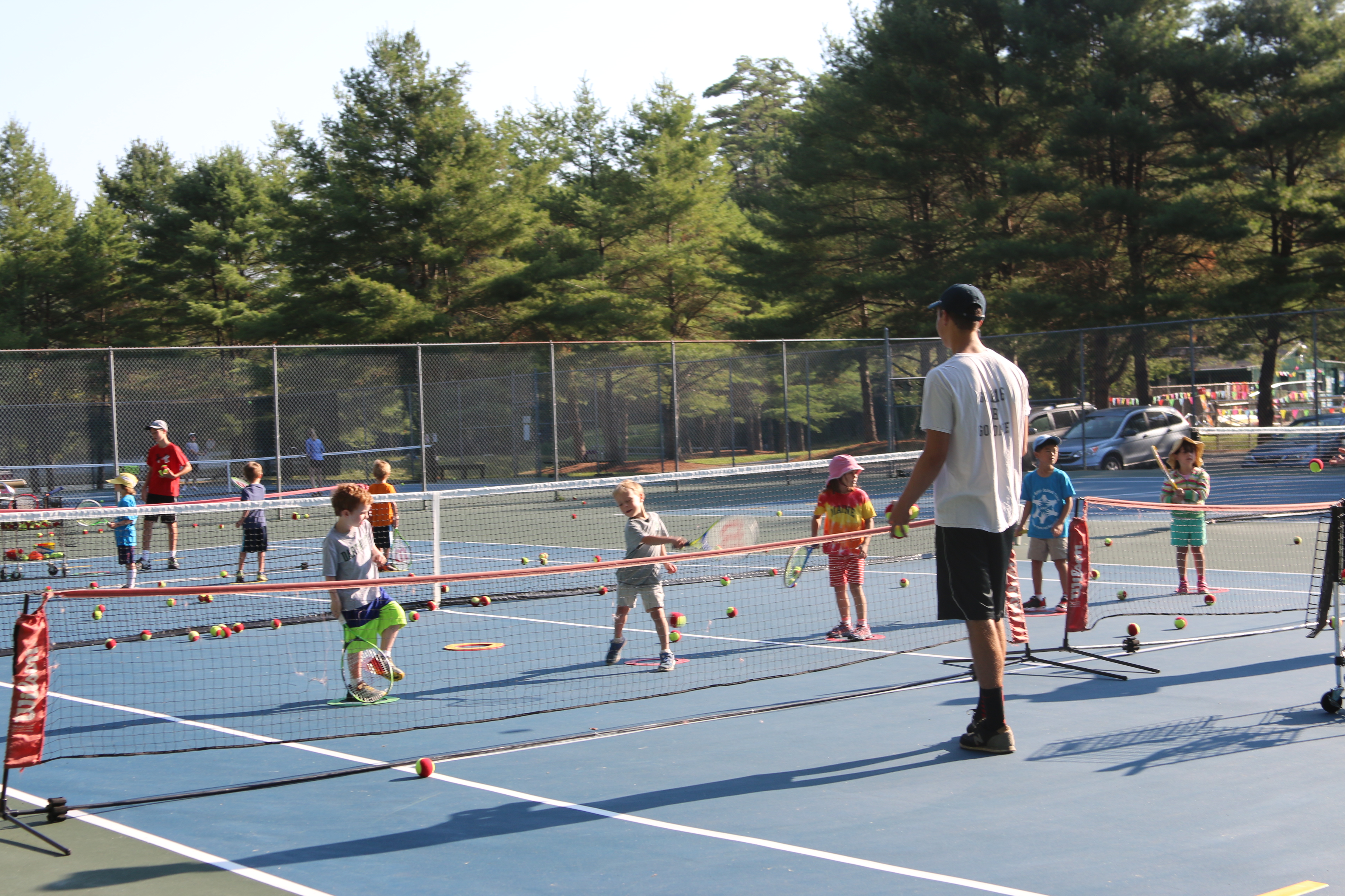 kids on tennis court for camp